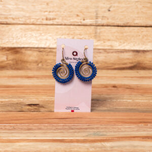 A pair of handcrafted golden brass drop earrings featuring a tightly coiled wire spiral disc, tightly bordered around the outer edge with small, vibrant royal blue seed beads.