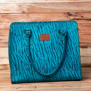 A structured turquoise leather tote bag featuring a navy blue tiger-stripe embossed pattern, matching shoulder straps.