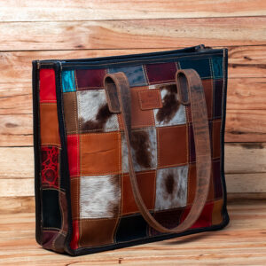 Patchwork leather tote bag with multicolored leather panels and sturdy shoulder straps.Has compartments and a zip on the inside.