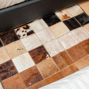 White and brown patched rug (45 by 30 inches)