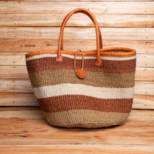 A Size 12 striped brown, olive, and cream woven sisal tote bag with tan leather handles.