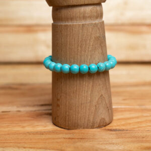 A polished turquoise stone beads strung on a durable elastic band.