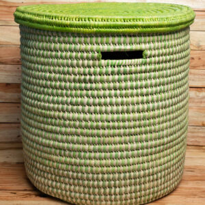 A large cylindrical woven laundry hamper in green and natural cream with a solid green lid and cut-out handles.